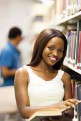 Female College Student Poses in Undergrad Library