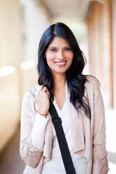 Female College Student Poses in Business School Hallway