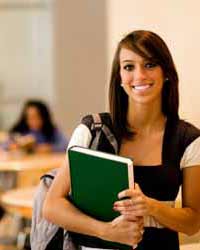 Female College Student Poses for Photo in Student Union Building